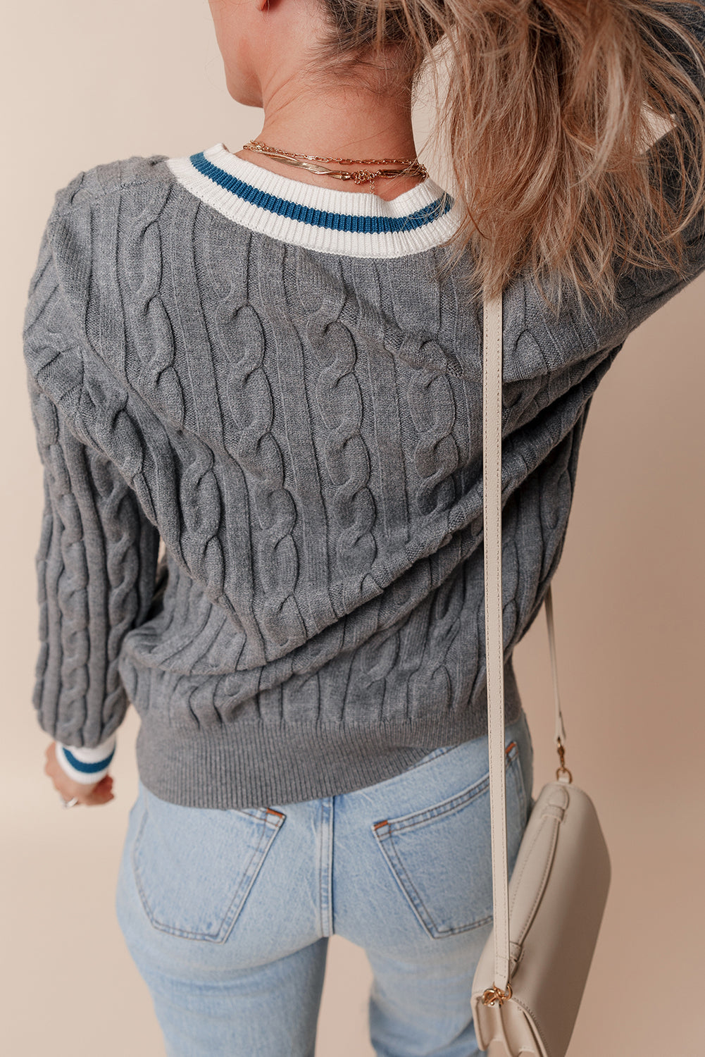 Cable knit v-neck sweater with contrasting ribbed cuffs in medium grey