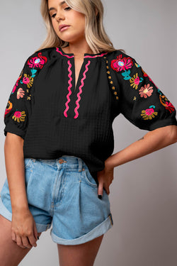 Black textured blouse with puffy sleeves and Ricrac floral embroidery