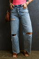 Light blue right jeans torn and torn in raw hem