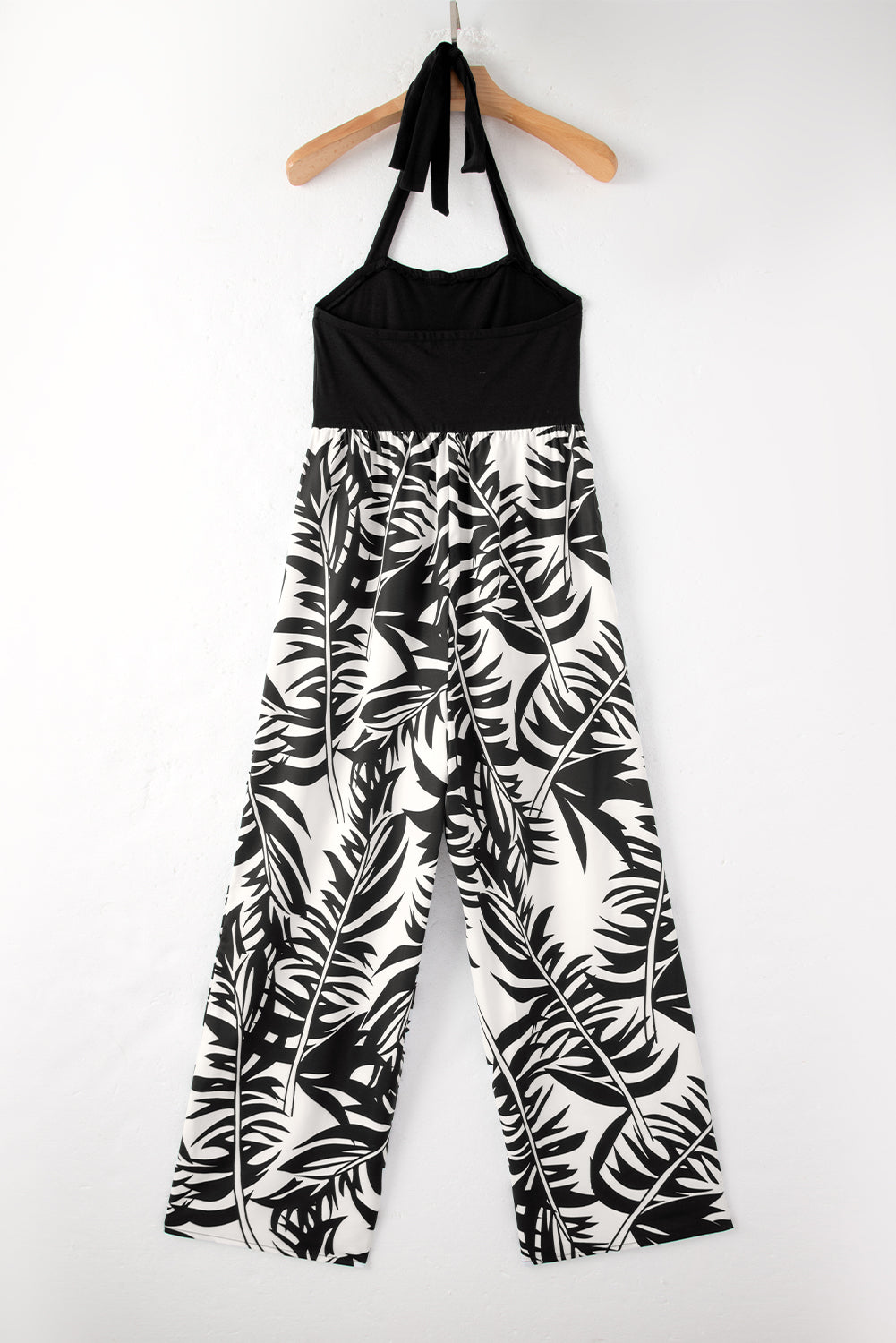 Black wide leg jumpsuit with tropical plant print