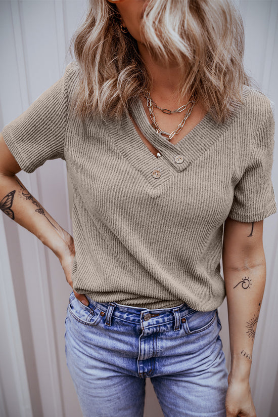 Pale chopped khaki t-shirt with buttoned suspenders and v-collar