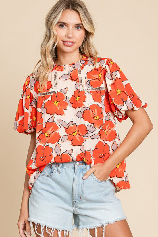 Blusa de manga suelta naranja y cuello volador y patrón floral