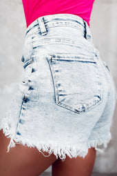 Light blue acid washed raw edge crossover denim shorts