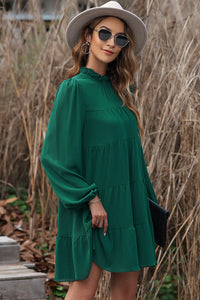 Green dress with ruffles and puffy sleeves *