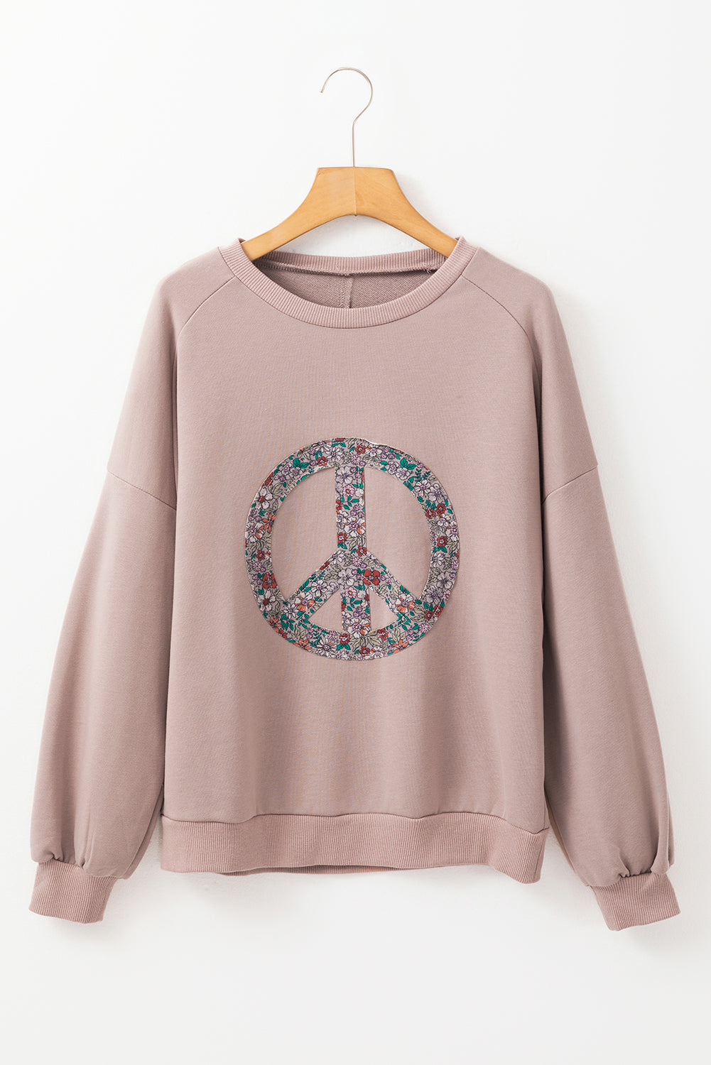 Sweat-shirt à épaules tombantes et symbole de paix floral en chèvre