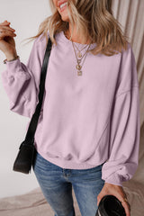 Sweat-shirt à épaules tombantes et manches chauve-souris avec coutures apparentes et pétales d'orchidées
