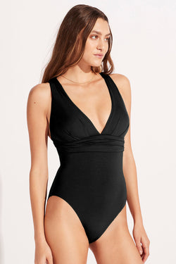 Black monokini with a deep -turned V -neck collar Gathered dar