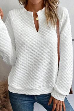 White quilted top with long sleeves and split collar