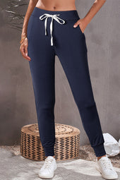 Navy blue jogging pants with pockets and drawstring waist