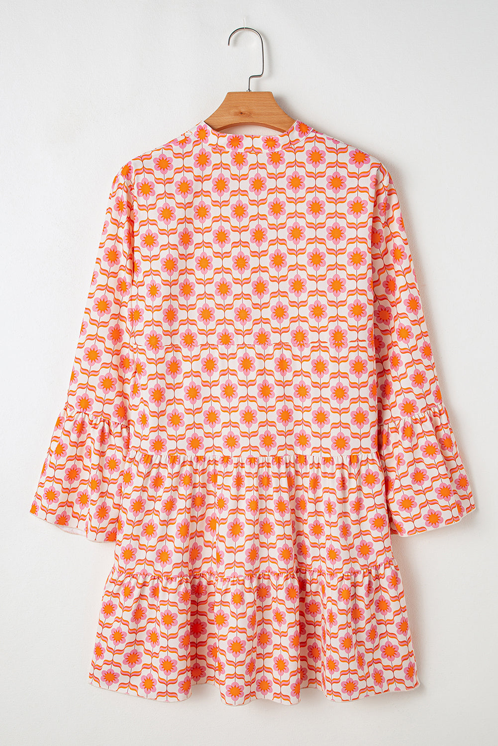 Orange floral print mini dress with ruffle sleeves and button front