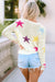 White loose sweater with colorful star pattern