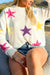 White loose sweater with colorful star pattern