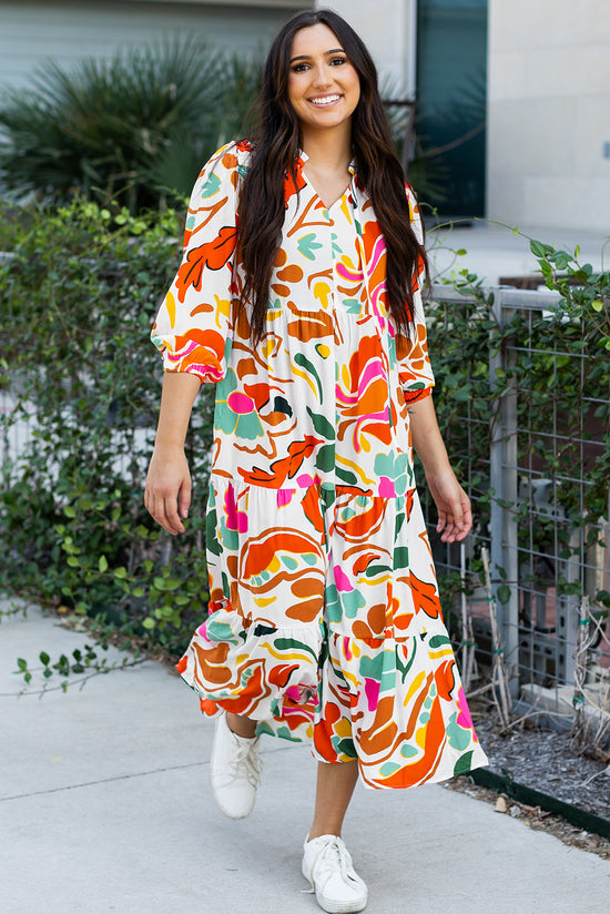 Vestido de naranja largo con un estampado floral dividido con cuello en V y varios niveles