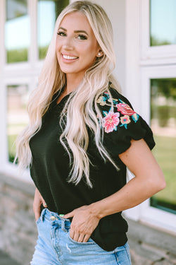 Black high with V -neck and puffy sleeves embroidered with flowers