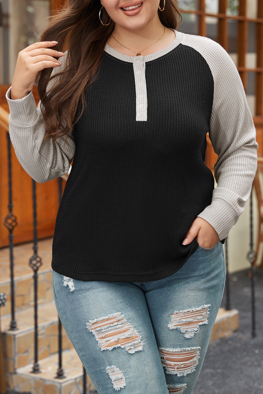 Large large size button in black contrasting knitting