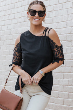 Black top with bare shoulders and lace straps