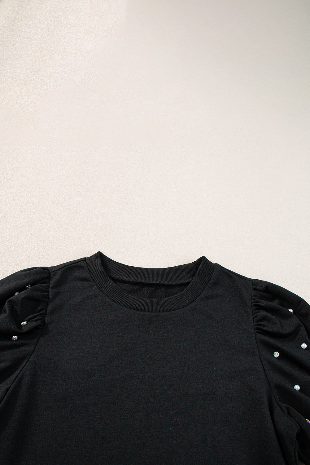 Black top with mid-long puffing sleeves with pearls and rhinestones