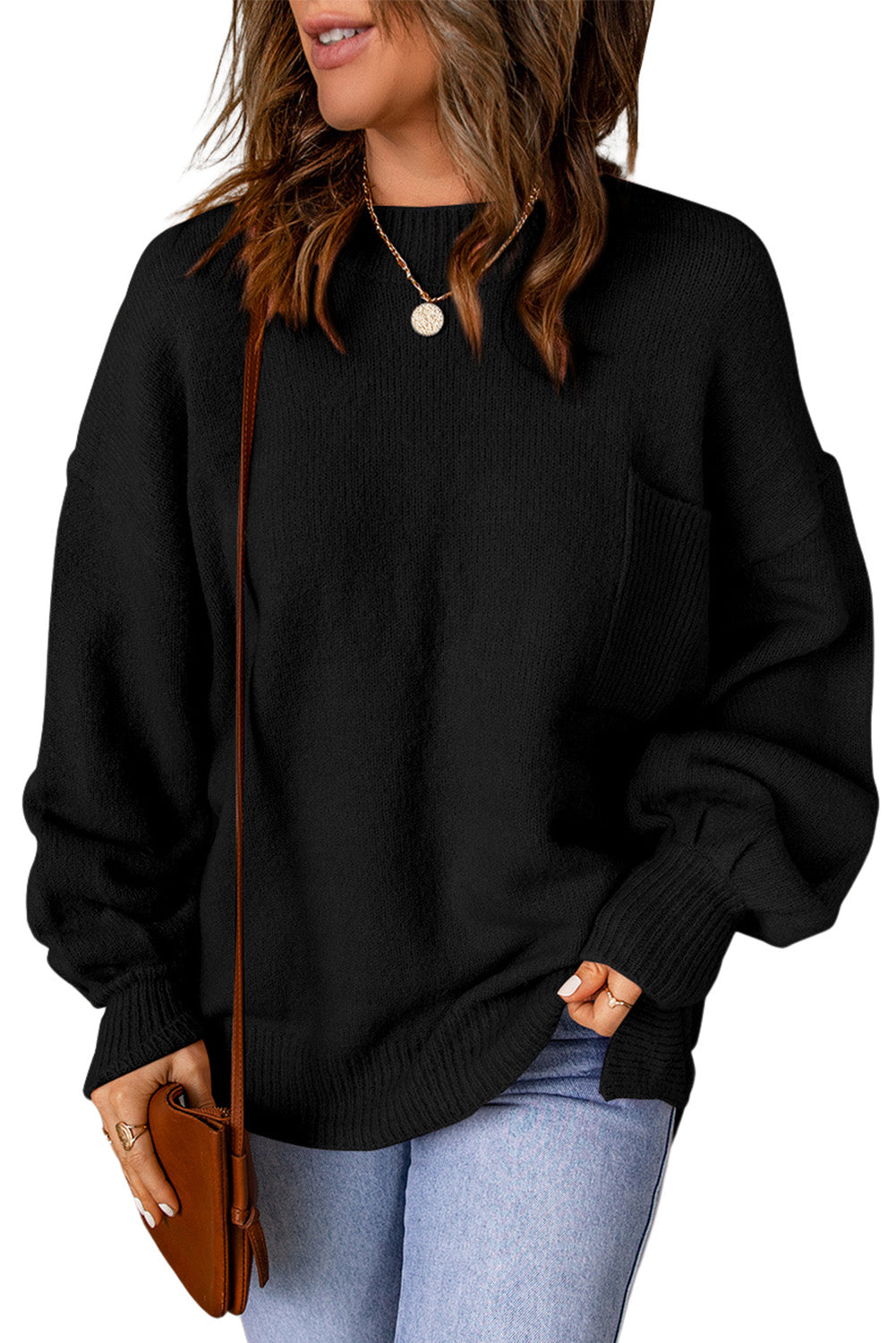 Black sweater with puff sleeves and solid color pockets