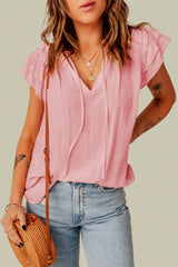 V -collar high in V -collar with tightening cord and flyers on several levels