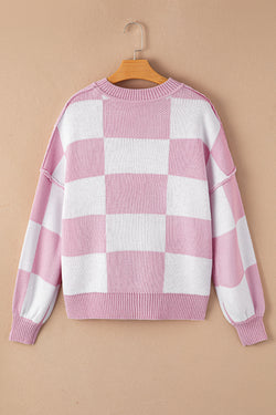 Pull rose à carreaux et manches évêque