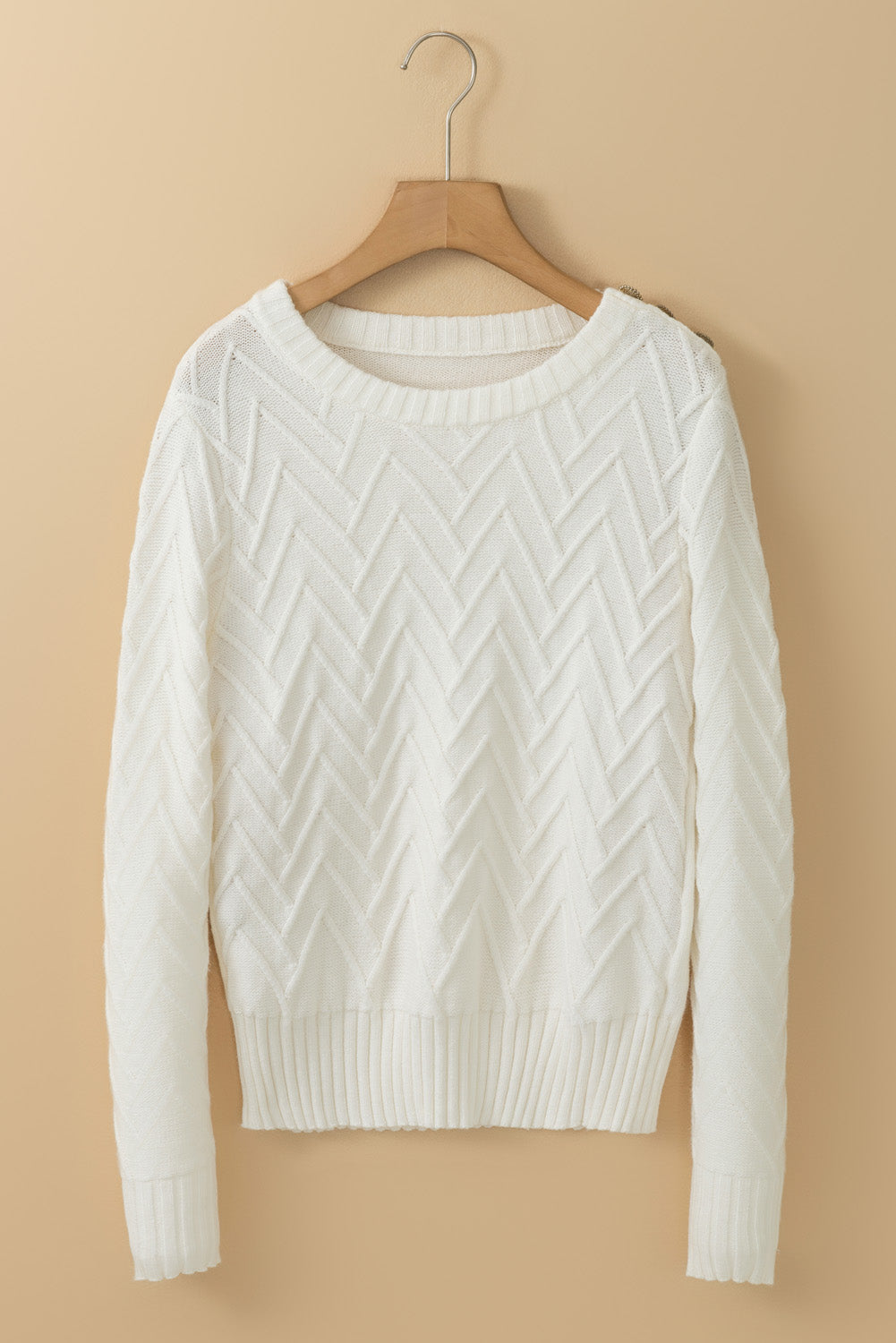 White textured knit sweater with decorative buttons