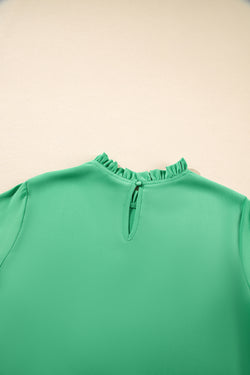 Green blouse with ruffles, round neck *