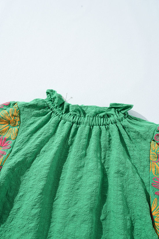 Bright green with short sleeves puffy and ruffled collar buttoned on the back