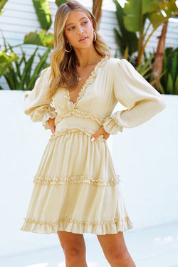 Beige V-neck dress with ruffles and open back