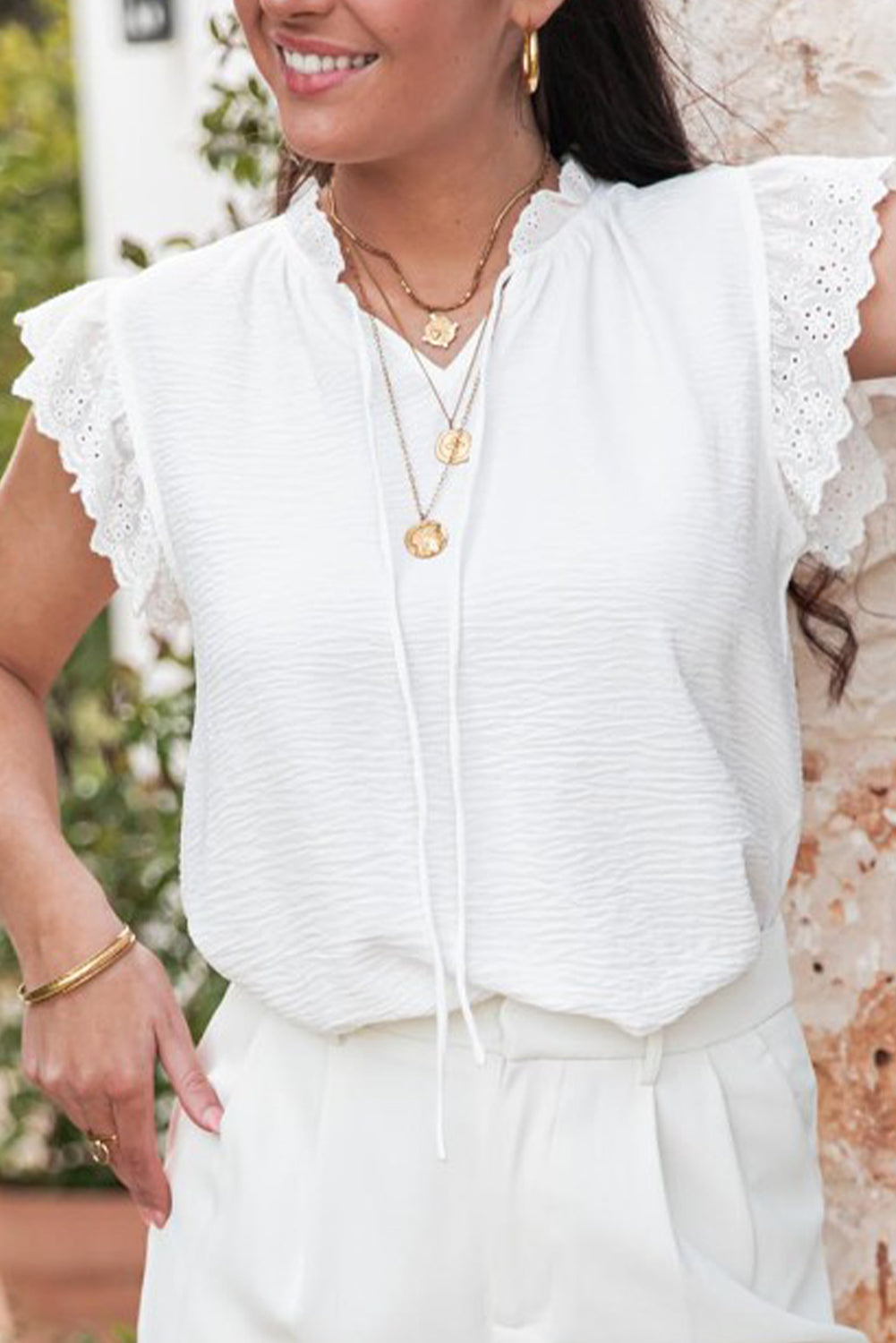 White textured blouse with embroidered ruffles *