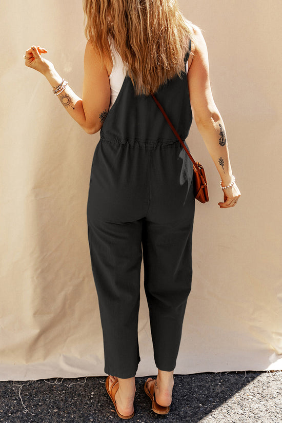 Black short overalls with buttoned straps and drawstring