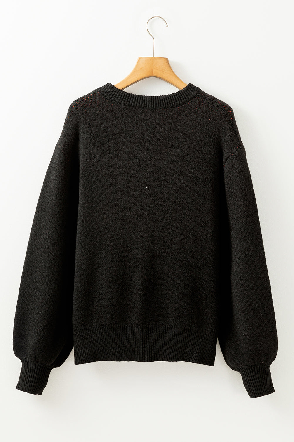Black shoulder sweater and Halloween pumpkin face pattern