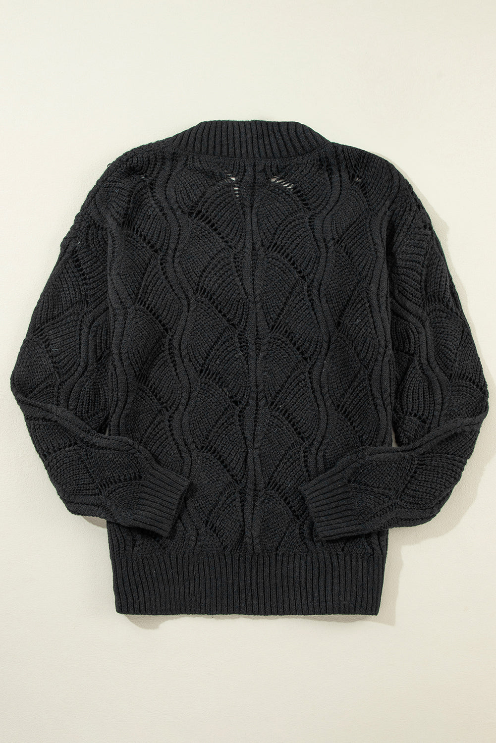 Black openwork knit sweater with V-neck and dropped shoulders