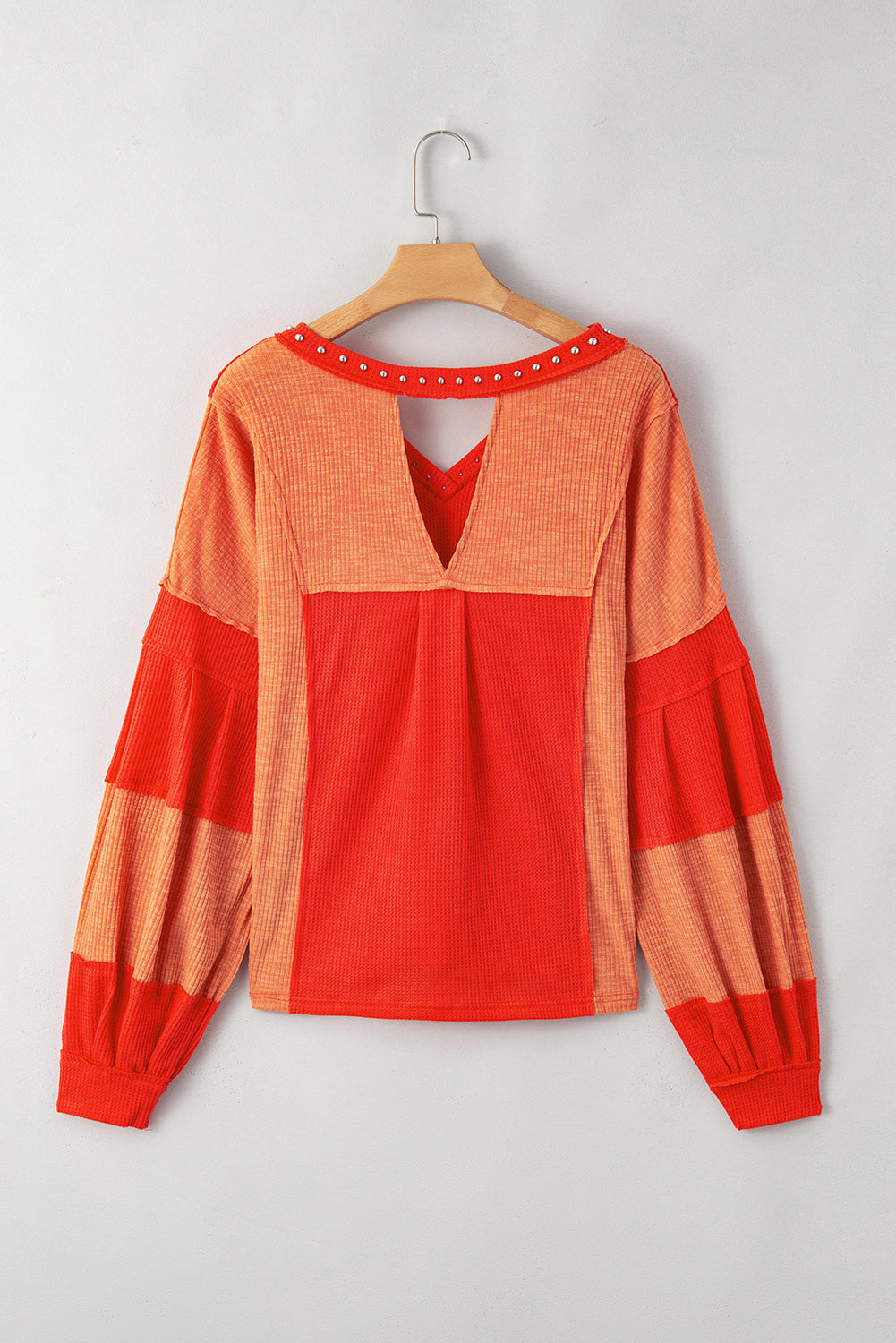 Fiery Red Studded V Neckline Exposed Seam Textured Knit Top