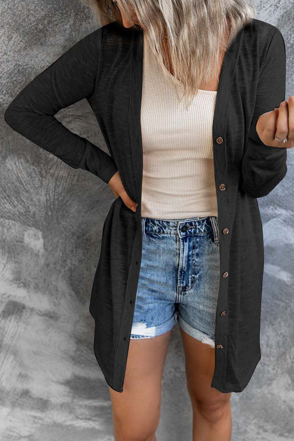 Black open button cardigan in solid color