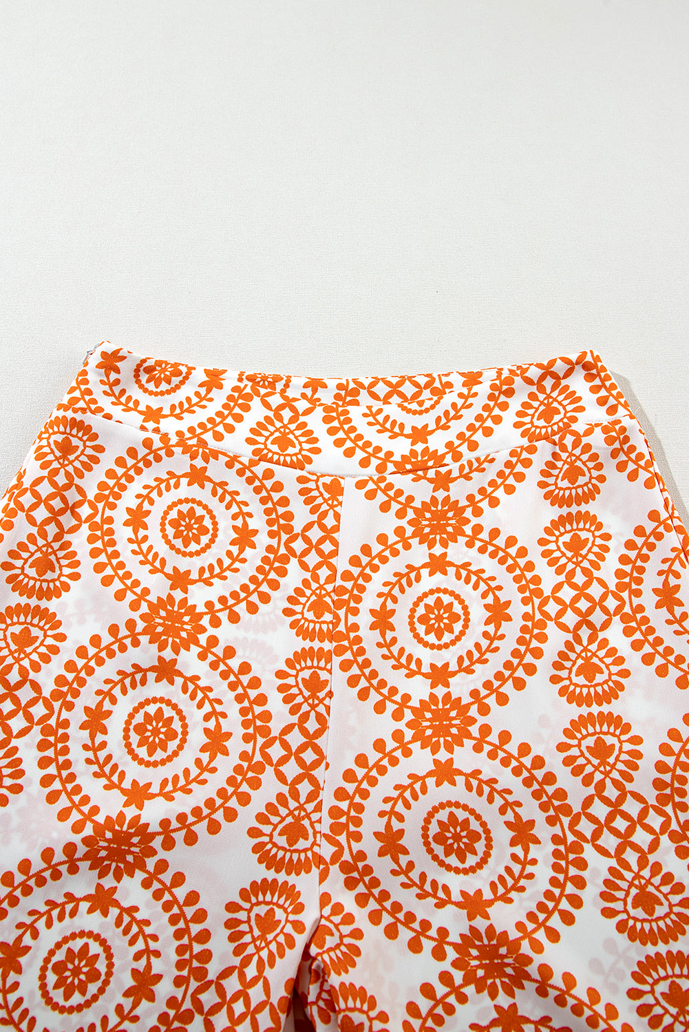 Pantalon large orange à imprimé floral style bohème rétro