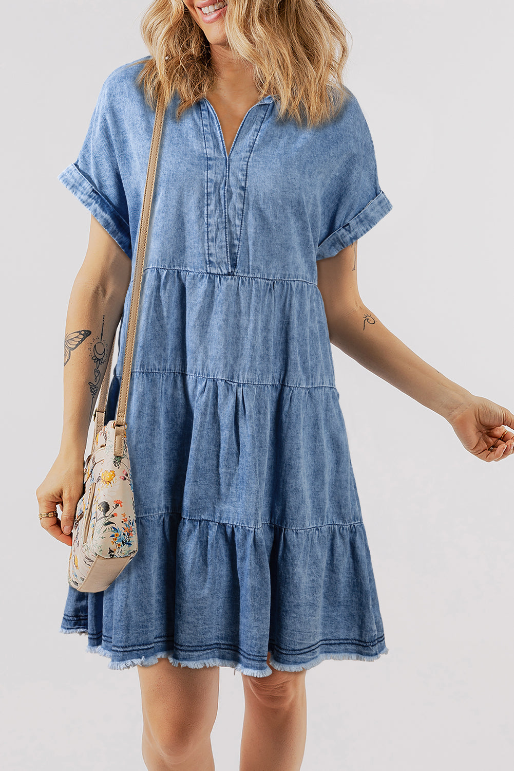 Denim dress with several levels and faded V -collar with sky blue acid