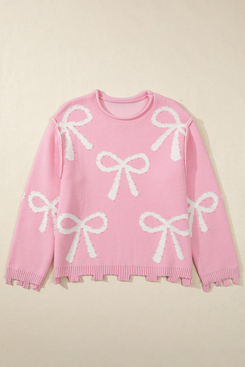 Pull à ourlet fendu en détresse à motif de nœud perlé rose