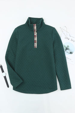 Green sweatshirt with geometric texture and plaid border