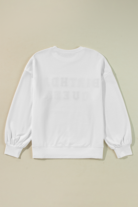 White sweatshirt with balloon sleeves and BIRTHDAY QUEEN print