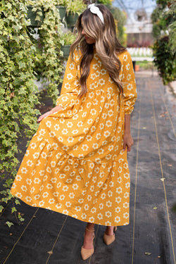 Vestido largo con collar y botones de manga pulsera y flores amarillas estampado