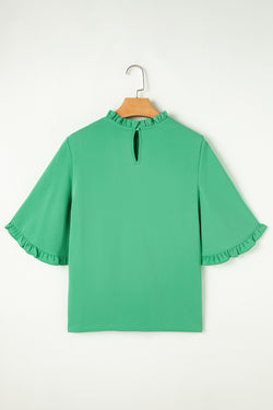 Green blouse with ruffles, round neck *