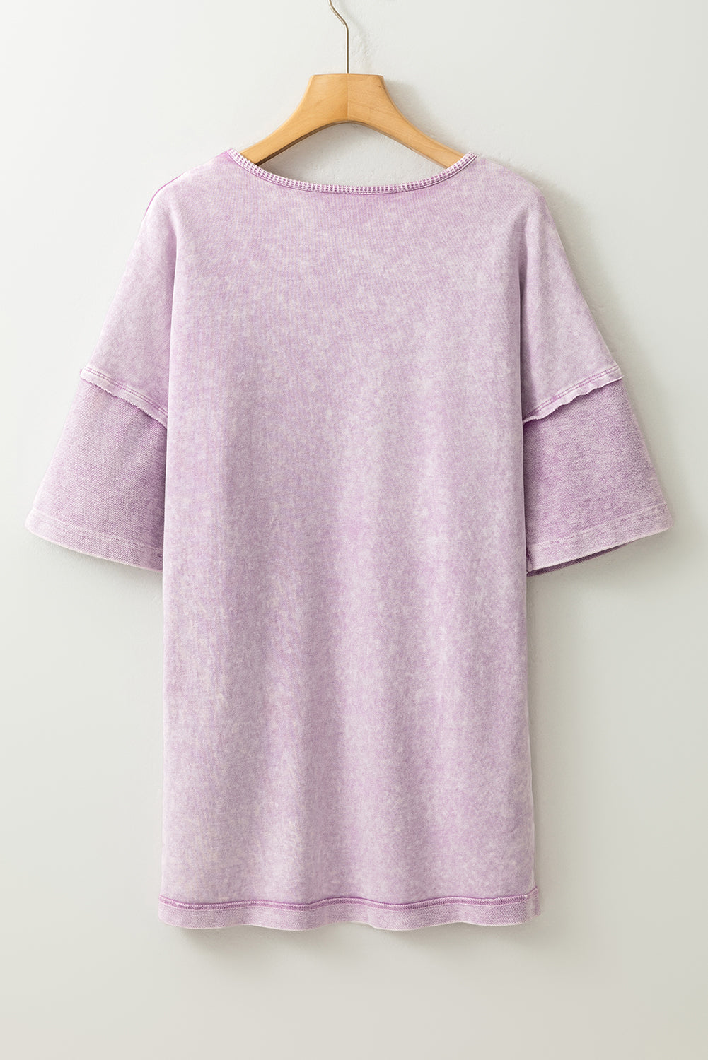 Surprised t-shirt with drooping shoulders and visible seams with mineral washed out and orchid petals