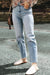 Light -blue right jeans faded with acid and raw edges