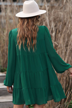 Robe verte à volants et manches bouffantes *