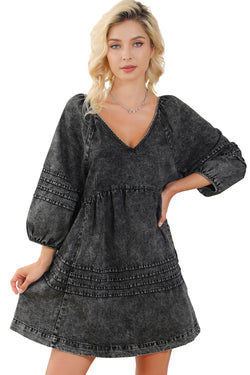 Black pleated denim babydoll dress with v-neck and puff sleeves