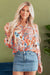 Large shirt buttoned with frowned and orange floral print