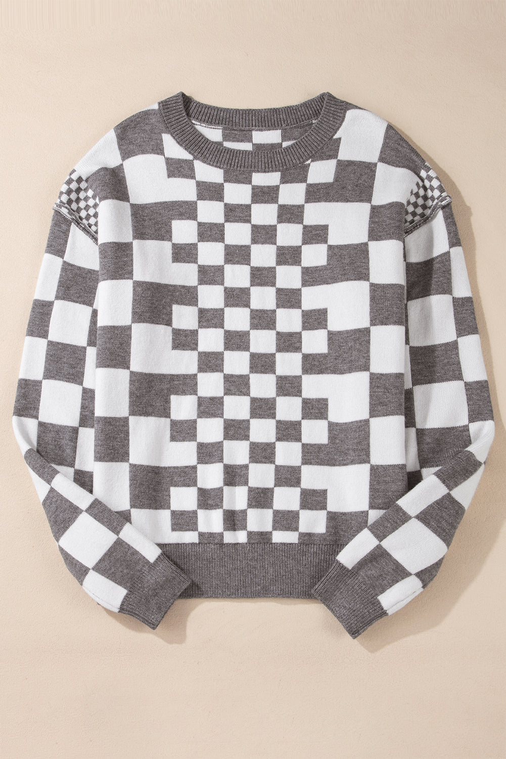 Pull gris à carreaux et épaules tombantes, col rond