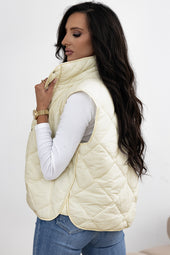 Beige quilted vest coat with high collar and buttoned pocket