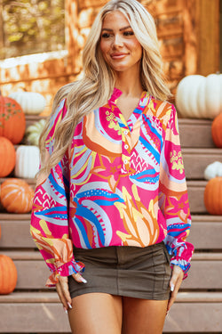 Pink blouse with abstract print and ruffle sleeves buttoned in V -neck