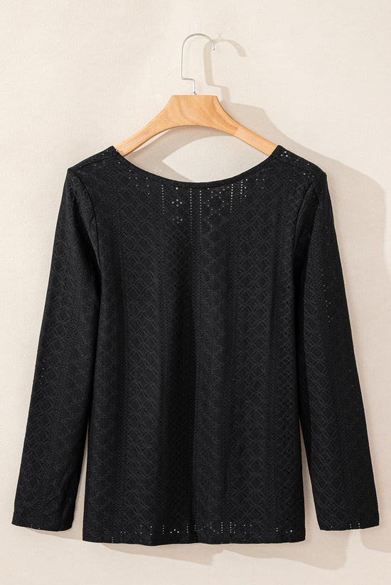 Black long sleeve top with floral lace eyelets